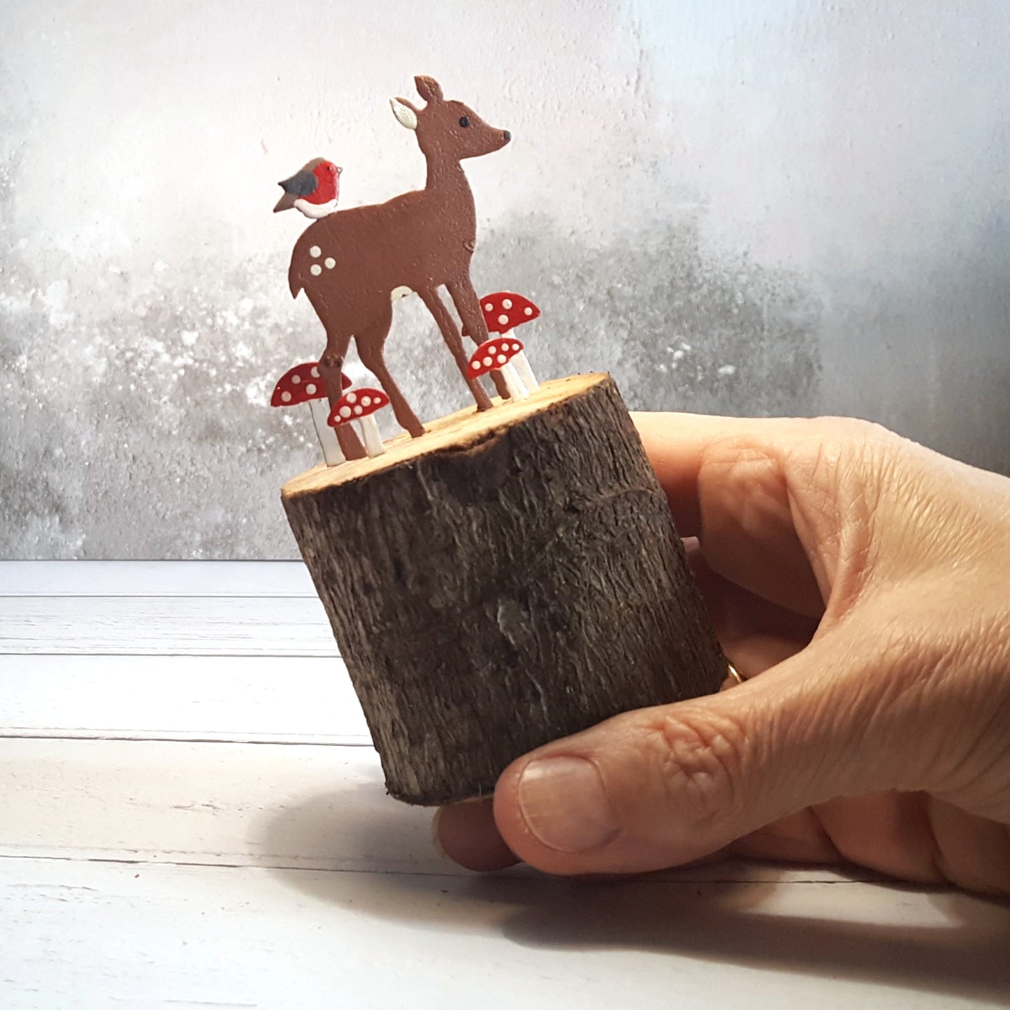 Deer & Robin on a Toadstool-Covered Wooden Log