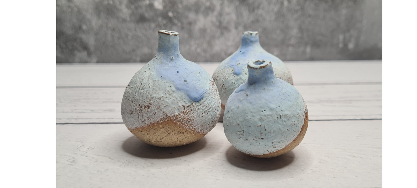 Three Tiny Overlapped Stoneware Bottles